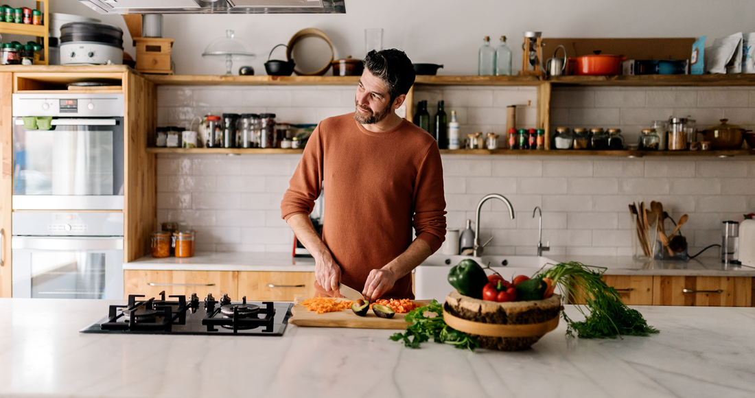 A man cooking preparing a meal in the kitchen